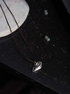 Accessories: Silver Almond Shell on Brown Silk Necklace