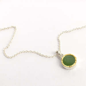 DM380C: Light pounamu gold edged pendant