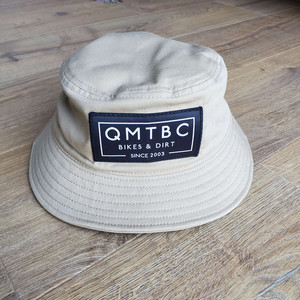 Products: QMTBC khaki bucket hat QMTBC