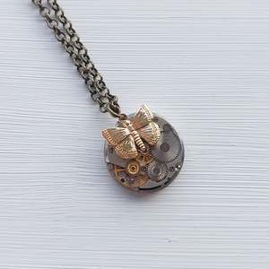Bestseller - Mini timepiece pendant with golden butterfly