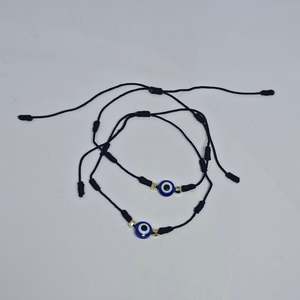 Under 10: Evil Eye 7 Knot Wax Bracelet