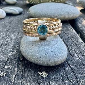 Spinner And Unity Rings: Blue topaz Fine unity ring in 9ct gold