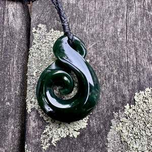 Dark New Zealand greenstone rau kumara koru