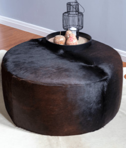 Furniture: Round Cowhide Ottoman - Solid Black