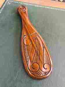 Maori New Zealand: Aoraki wood carved Maori Patu on Stand