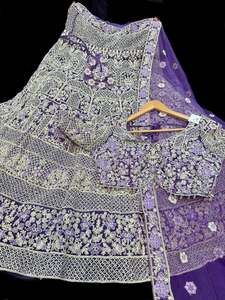 Womens: (Video clip attach)size 40 (upto42)fully stitched Purple color engagement /semi bridal lehnga with full of stones & embroidery work heavy multi flared and with very heavy embroidery work netting dupatta and blouse piece