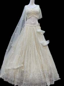 Womens: (Video clip attached )(Size 38 and can be altered upto 40)Party wear cream color heavy sequined and pearls with embroidery work multiflared very heavy lehnga with heavy work design in blouse and embroidery dupatta