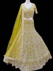 Womens: (Video clip attach)size 38(upto 42)fully stitched Yellow Green color engagement /semi bridal lehnga with full of stones , pearls , sequined & embroidery and Mirror work all over heavy multi flared and hand work netting heavy dupatta and stylish blouse