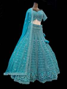 Womens: (Video clip attach)size 38(upto 42) fully stitched Teal color Partywear lehnga with full of embroidery, stones and Mirror work all over heavy multi flared and hand work netting heavy dupatta and stylish blouse