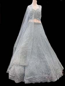 Womens: (Video clip attach)size 38(upto 42) fully stitched Lite Grey Silver color Partywear lehnga with full of embroidery, stones and Mirror work all over heavy multi flared and hand work netting heavy dupatta and stylish blouse