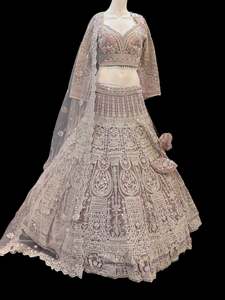 Womens: (Video clip attach)size 40 (upto42)fully stitched Purple color engagement /semi bridal lehnga with full of stones & embroidery work heavy multi flared and with very heavy embroidery work netting dupatta and blouse piece