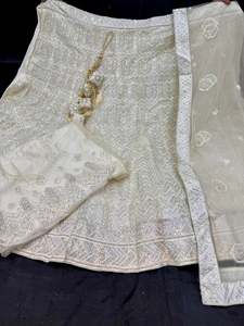 Party Wear Lehnga: (Video clip attached )Party wear cream color multicoloured sequined and embroidery work multiflared very heavy lehnga with heavy work design in blouse and embroidery dupatta (Unstitched Lehnga)