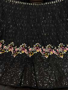 Party Wear Lehnga: (Video clip attached )Black color Party wear netting based full of sequined and multi embroidery work multiflared very heavy lehnga with heavy work design in blouse and embroidery dupatta (Unstitched Lehnga)