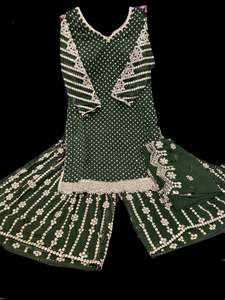 Sharara Lehnga Suits 1: Dark Green color georgette based all over sequined work kameez with heavy embroidery work sharara pants and georgette dupatta with embroidery work