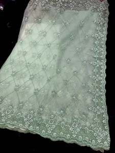 Heavy Work Sarees 1: (Video Clip attached )Mint color designer Saree with netting base fabric and stones work design all over with heavy embroidery work