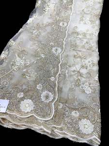 Heavy Work Sarees 1: (Video Clip attached )White color Heavy work designer Saree with netting base fabric and stones work design all over with heavy embroidery work