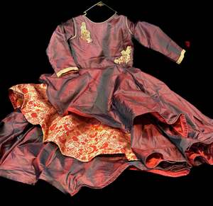 Dark maroon colour silk based beautiful flared gown