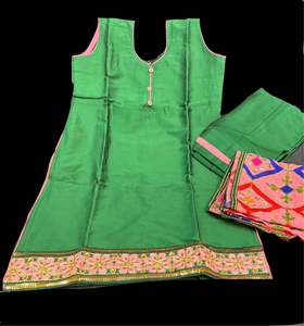 Green colour silk based kids punjabi suit with contrast phulkari dupatta