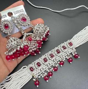 Choker Necklace: Beautiful silver jerkan stones and white pearls work classy choker set with beautiful earrings & Tikka