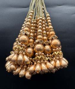 Latkans: Beautiful golden design small size lehnga latkans tessels (pair)