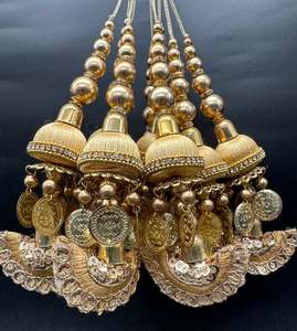 Beautiful golden design medium size lehnga latkans tessels (pair)