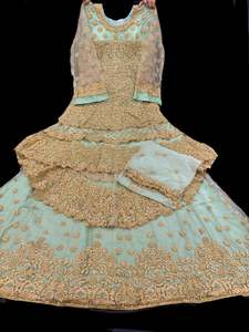 Womens: Mint color netting based golden stones, pearls and embroidery work all over front & back of kameez with stone work and beautiful lehnga & Georgette dupatta (Size 40 and can be altered upto 42)