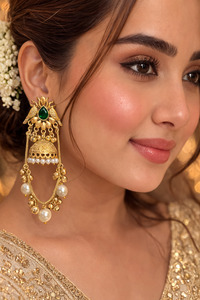 Jewellery: (Video clip attached)Trending Kashmiri Earrings /Premium gold-tone finish Elegant emerald-green stone centerpiece.Traditional Kashmiri-inspired design.Handcrafted dome jhumka with pearl embellishments.Lightweight and comfortable for long wear