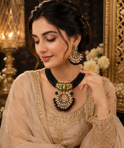 Jewellery: Black pearls & meenkari work beautiful choker set with kundan stones(slight variation in color and design is possible)
