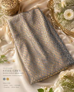 Fabrics: Grey brocade silk Fabric (price per meter) perfect for stitching blouses /skirts /suits (aprox 112cm width )slight variation in color may occur
