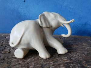 Laying down elephant figurine - Buttermilk