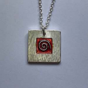 Pendant: Koru pendant with red cloisonne enamel