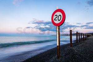 Products: 20 kph sign on the beach, Te Awanga, Hawke's Bay, New Zealand - SCP Stock