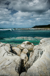 Products: The rocky shoreline, Whangawehi, Mahia Peninsula, New Zealand - SCP Stock