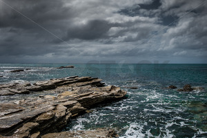 The rocky shoreline, Whangawehi, Mahia Peninsula, New Zealand - SCP Stock