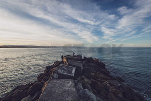 Fishing of the rocks, Perfume Point, Ahuriri, Napier, New Zealand - SCP Stock