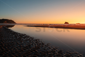 Products: The Rocks (Hine Mahanga) at sunrise, Kairakau Beach, Kairakau, Central Hawke's Bay, New Zealand - SCP Stock
