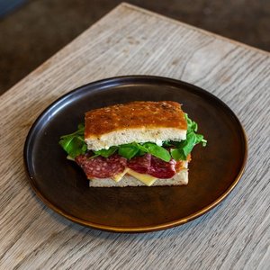 Products: Salami, Tasty Cheese, Tomato jam, Rocket, Basil mayo on Schiacciata