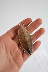 Fossilized coral set in silver snake chain necklace