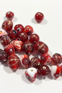 Under 20: Assorted red Italian glass beads