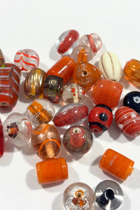 Beautiful, assorted orange glass beads