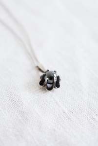 Under 50: Silver necklace with flower pendant