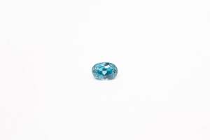 Gemstones: 5.2x7.1mm Zircon: 0.92ct Oval - Blue