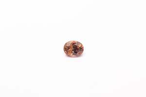 Gemstones: 6.2x7.9mm Zircon: 2.09ct Oval - Brown