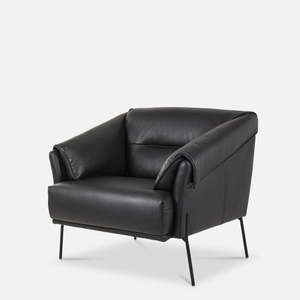 Saddle armchair in black leather