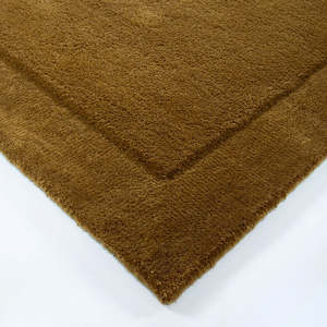 Norfolk rug in brass