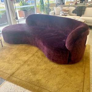 Hendricks curved sofa in mareeba burgandy