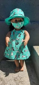 Pinafore style dress, hat and mask, green cat print. Fits 46cm doll