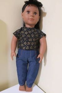 Products: Jeans and black Christmas top, fits 46cm doll