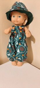Products: Overalls and matching hat, green wax print fabric, 30cm doll