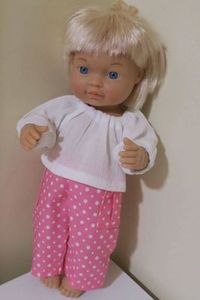 Products: Pants and shirt, pink with white spots, fits 30cm doll